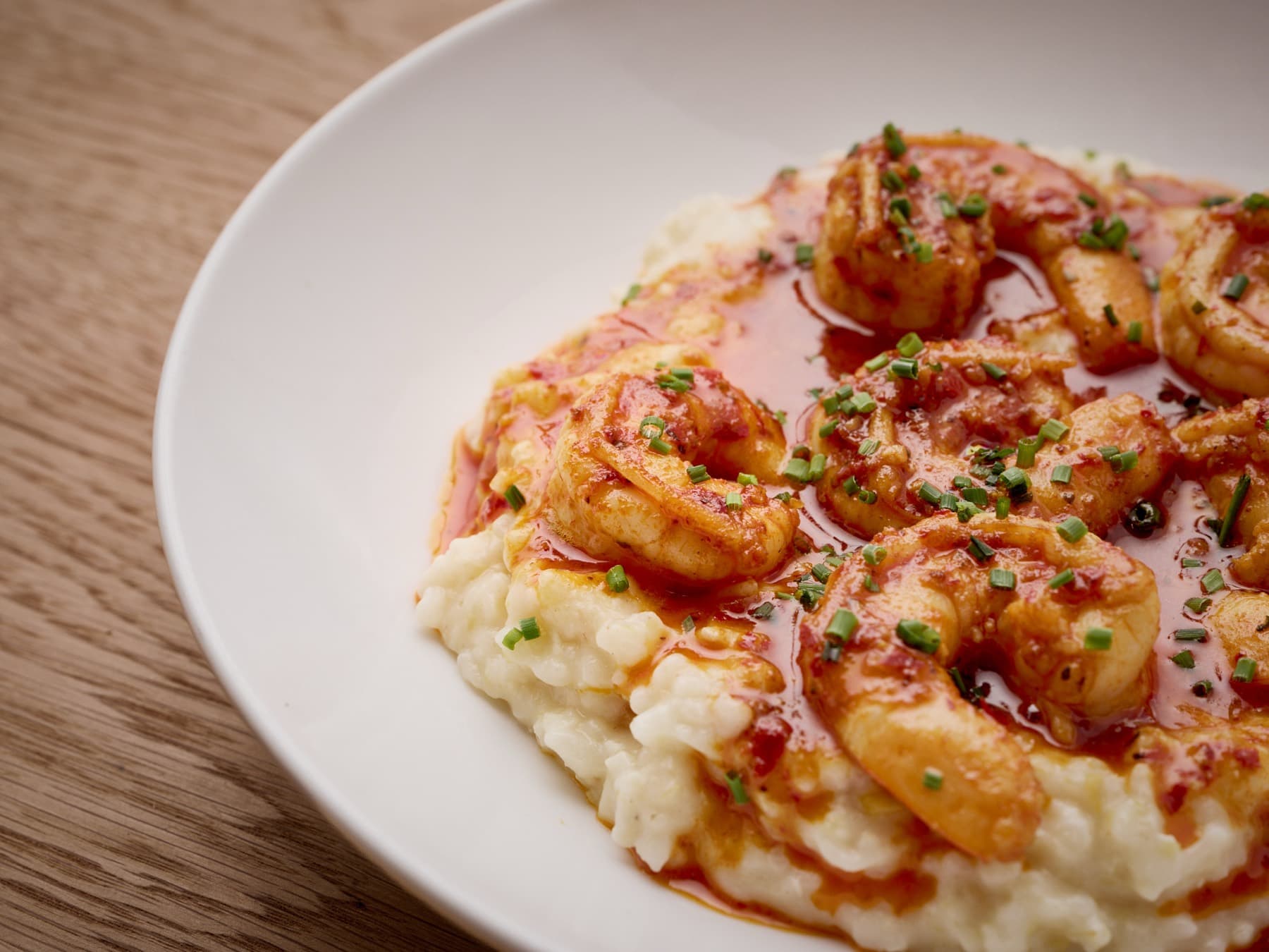 Shrimp over creamy grits with chile butter
